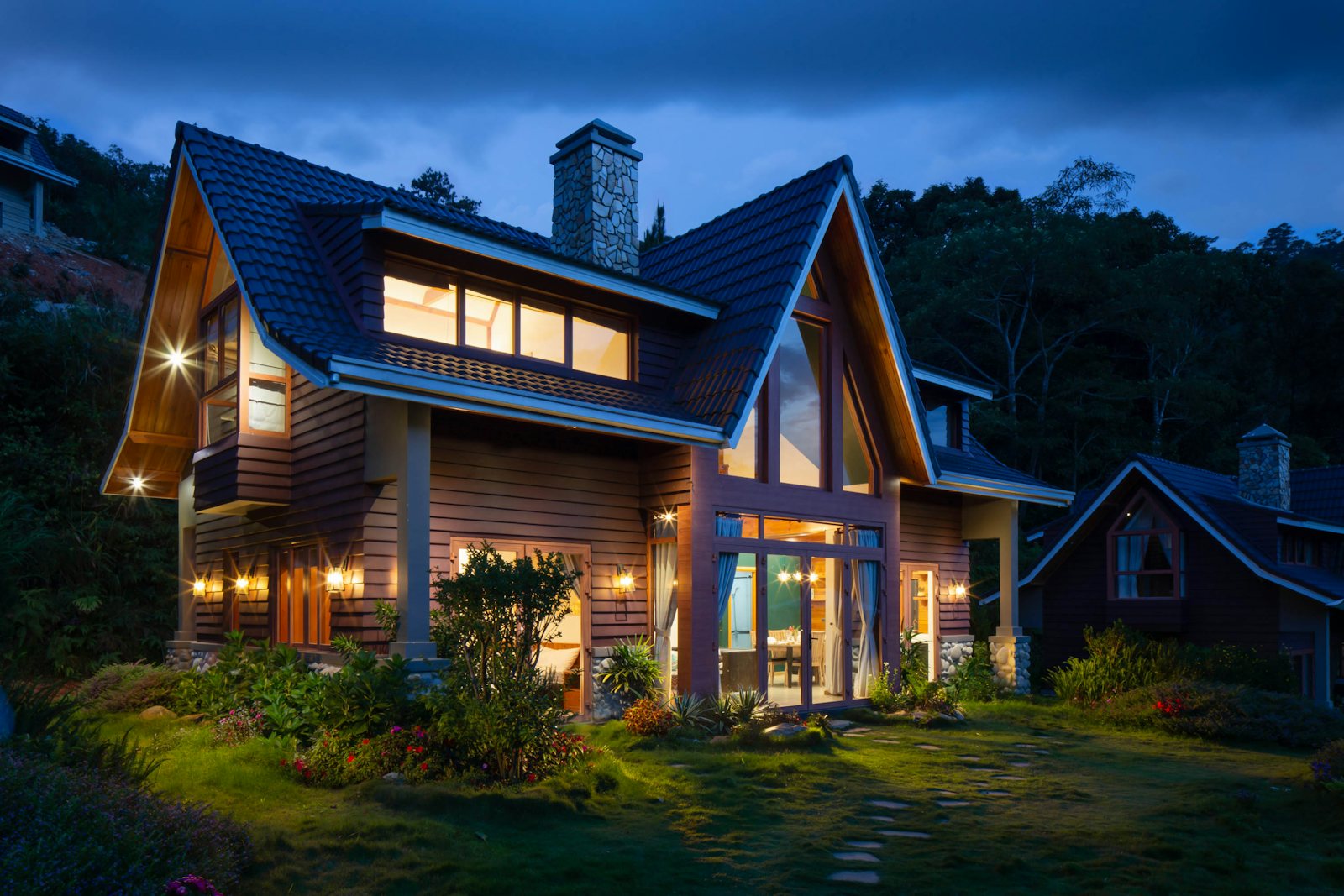Warmly lit craftsman home at dusk