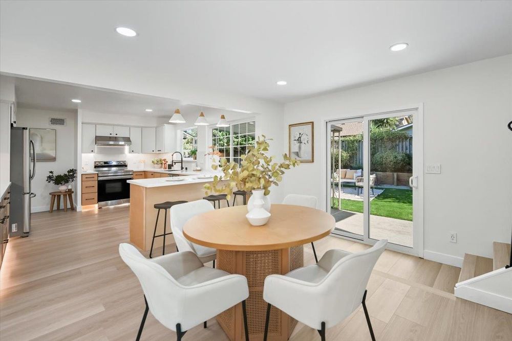 Dining area with sliders to backyard