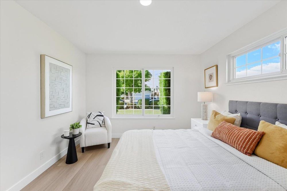 Primary bedroom with large windows
