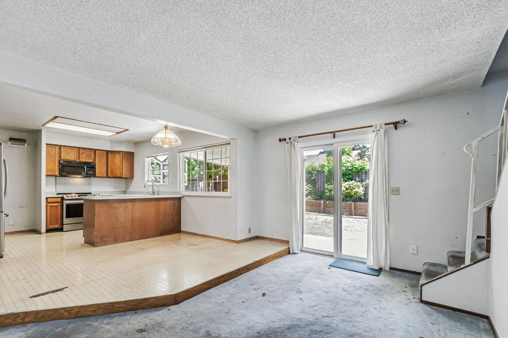 Kitchen before renovation: dated oak cabinets
