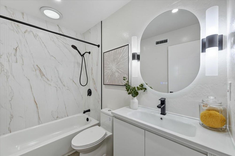 Bath with LED mirror vanity and tub