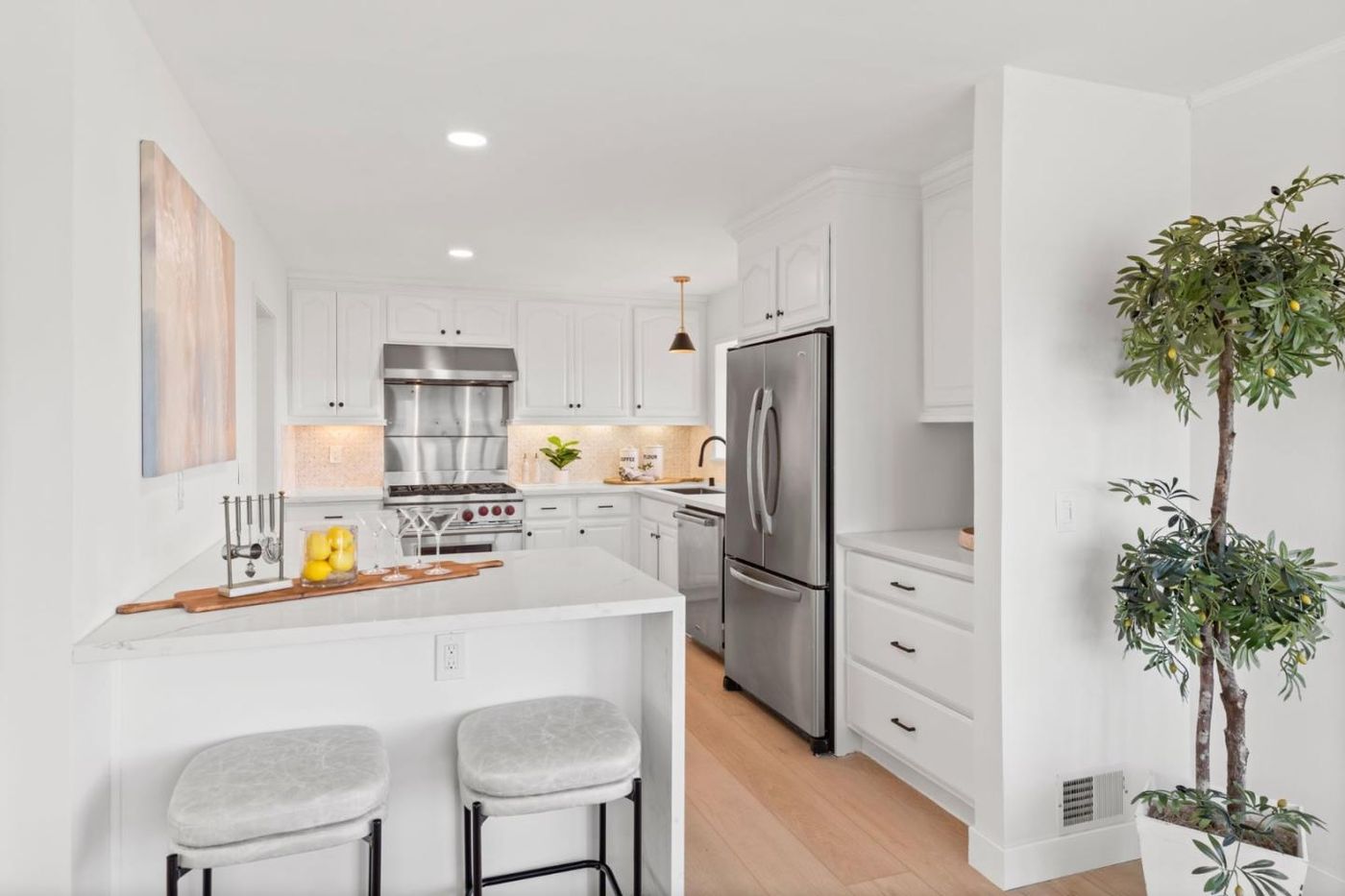 Renovated white kitchen with breakfast bar