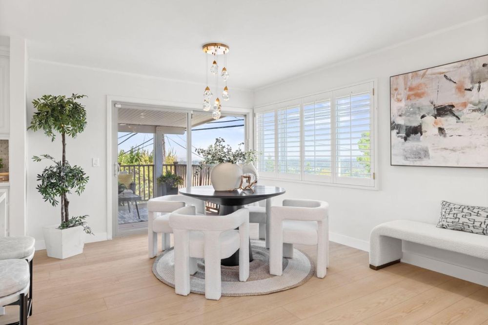 Dining nook with chandelier and view windows